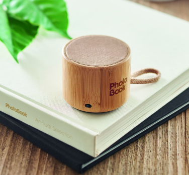 Logotrade promotional product picture of: Round bamboo wireless speaker