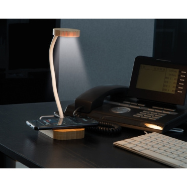 Logotrade meened pilt: Juhtmeta laadijaga laualampTomsk